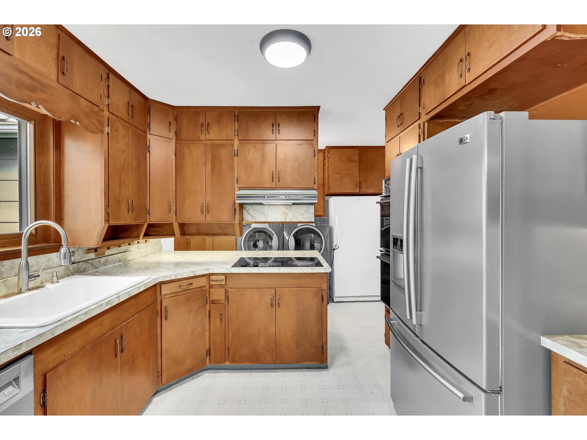 515 Harrison Street Fairview, OR 97024 - Photo 14 of 38 a kitchen with stainless steel appliances granite countertop a refrigerator a sink a stove and oven