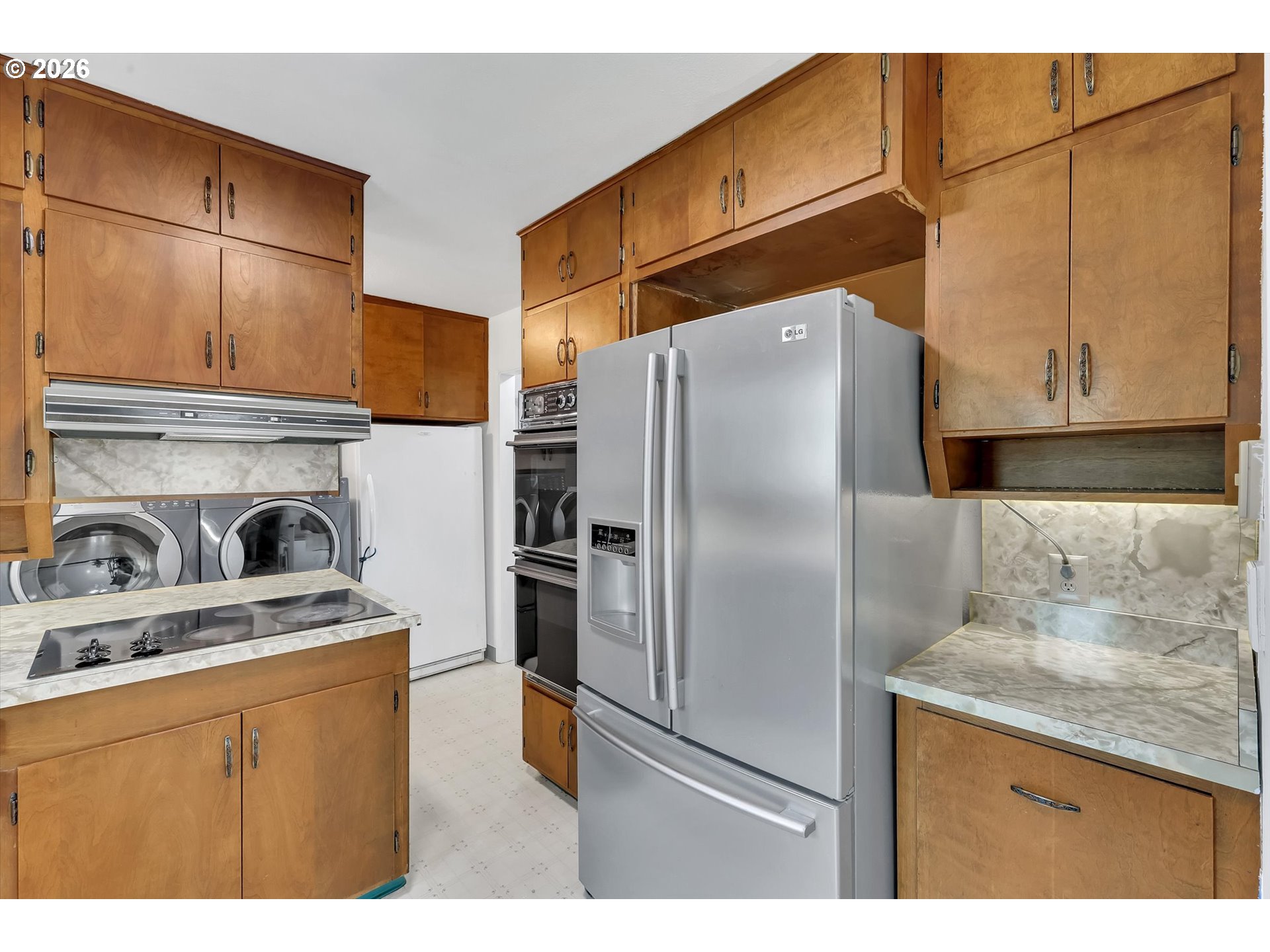 515 Harrison Street Fairview, OR 97024 - Photo 15 of 38 a kitchen with stainless steel appliances granite countertop a refrigerator a stove and sink