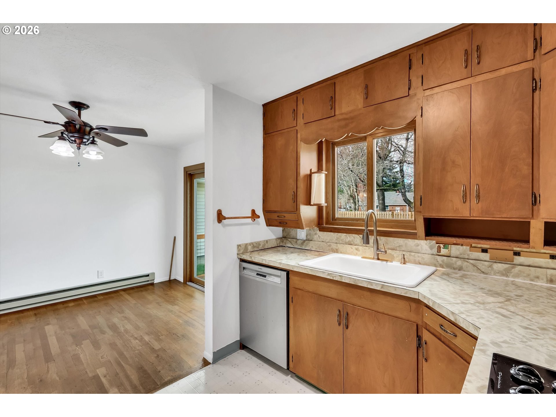 515 Harrison Street Fairview, OR 97024 - Photo 16 of 38 a kitchen with a sink cabinets and window