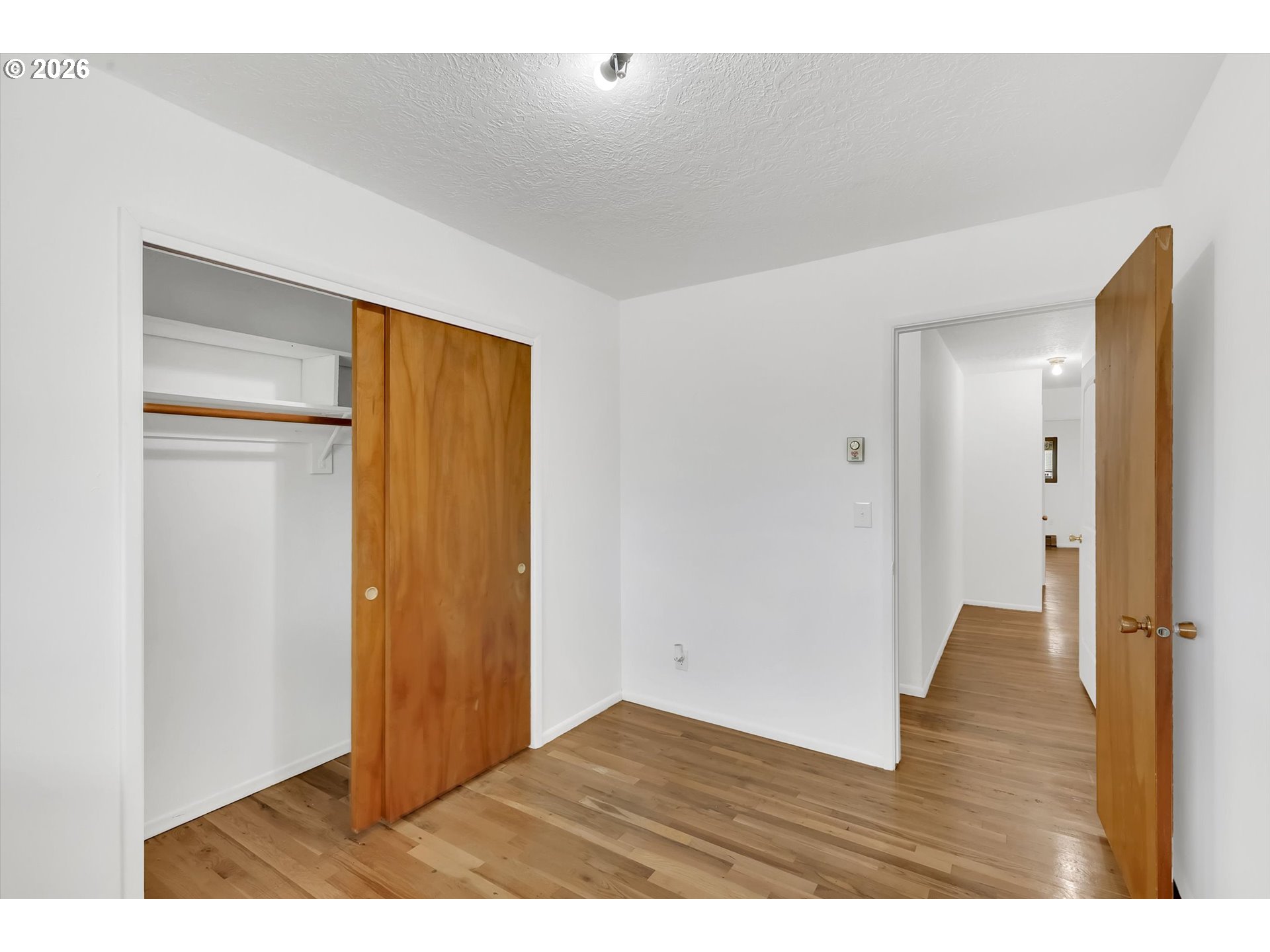 515 Harrison Street Fairview, OR 97024 - Photo 19 of 38 a view of an empty room with wooden floor