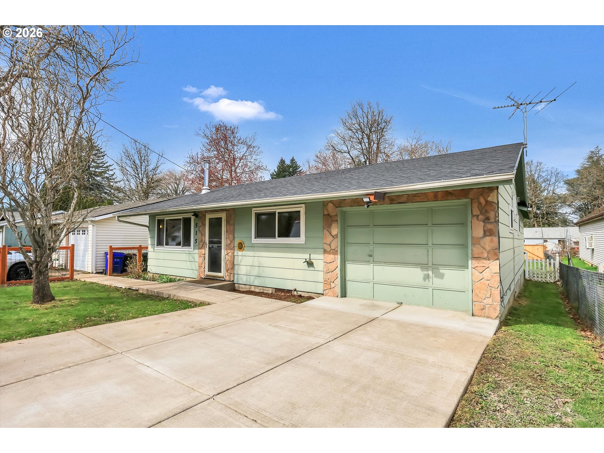 515 Harrison Street Fairview, OR 97024 - Photo 2 of 38 a front view of a house with a yard and garage