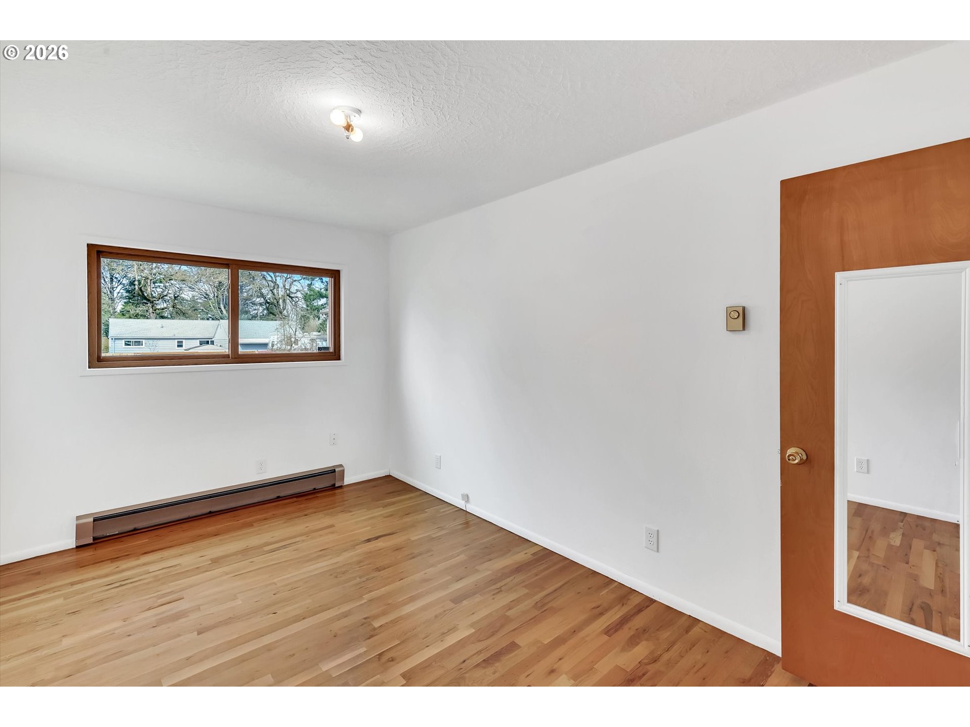 515 Harrison Street Fairview, OR 97024 - Photo 25 of 38 a view of an empty room with wooden floor