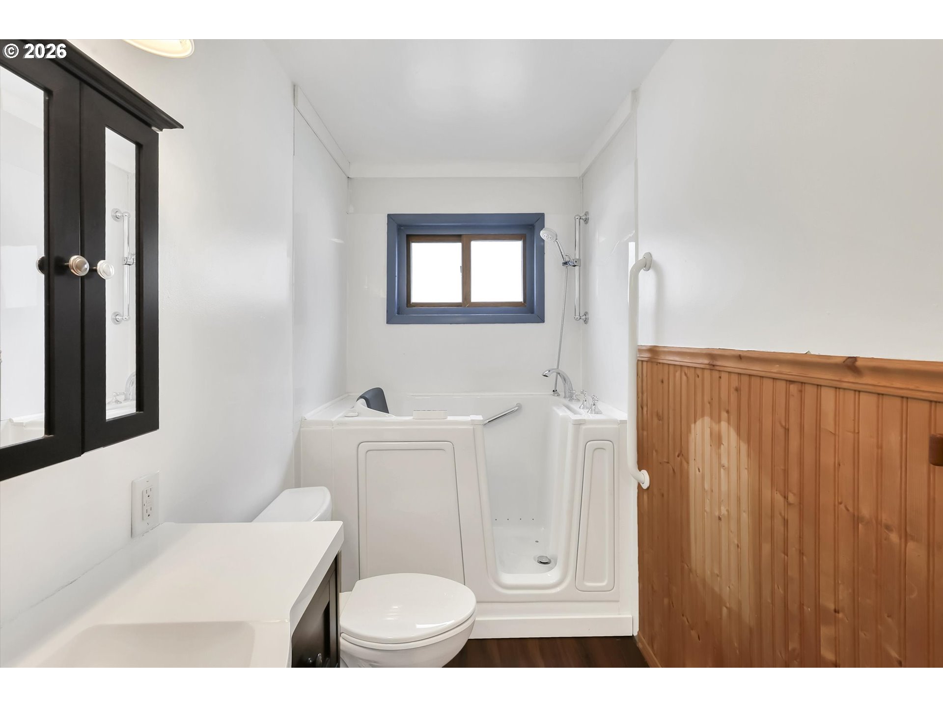 515 Harrison Street Fairview, OR 97024 - Photo 28 of 38 a bathroom with a toilet a sink and a mirror