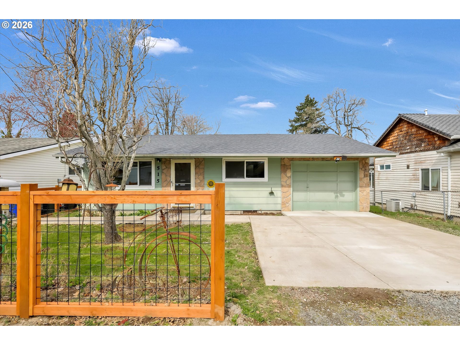 515 Harrison Street Fairview, OR 97024 - Photo 3 of 38 a front view of a house with a garden