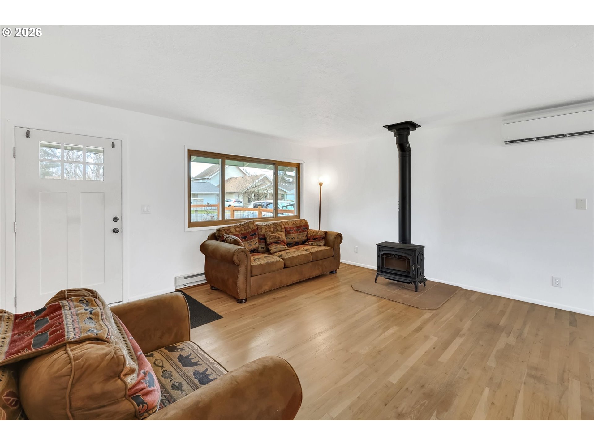 515 Harrison Street Fairview, OR 97024 - Photo 7 of 38 a living room with furniture a rug and a window