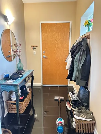 a living room with furniture and a mirror