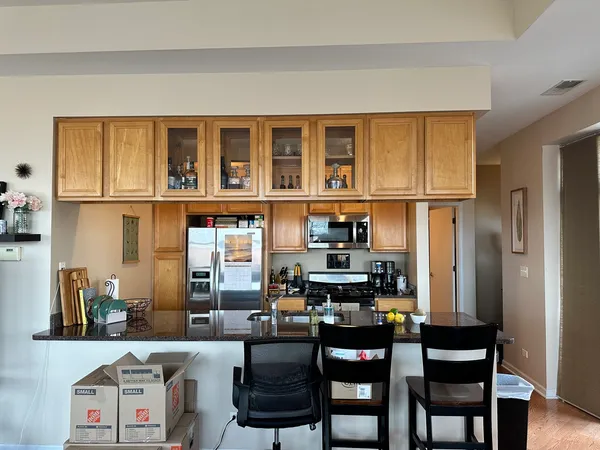 a dining room with furniture and a window