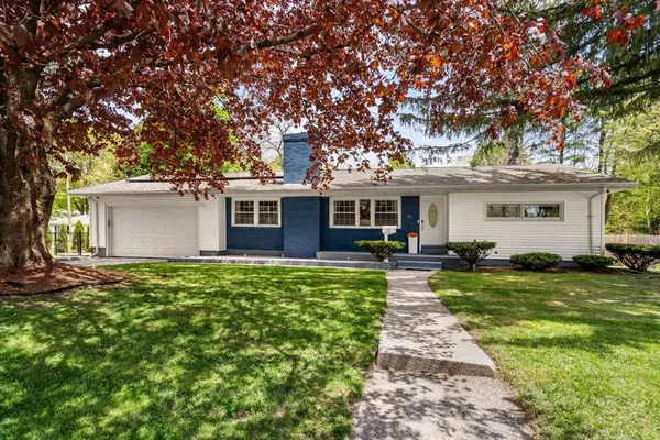 front view of a house with a yard