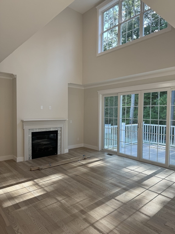 36 Meghan Circle Raynham, MA 02767 - Photo 12 of 37 a view of a livingroom with a fireplace and a window