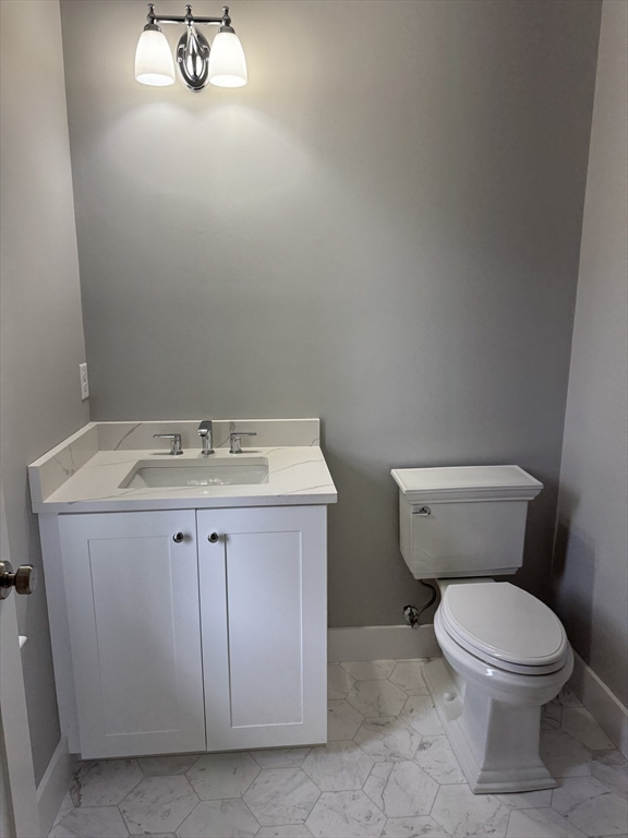36 Meghan Circle Raynham, MA 02767 - Photo 13 of 37 a bathroom with a toilet sink and mirror