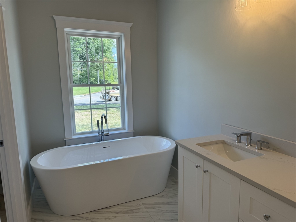36 Meghan Circle Raynham, MA 02767 - Photo 17 of 37 a bathroom with a bathtub and window