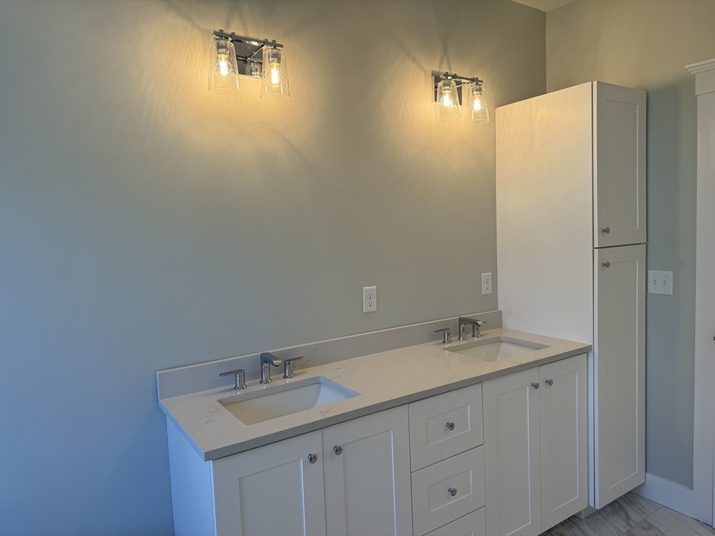 36 Meghan Circle Raynham, MA 02767 - Photo 20 of 37 a bathroom with a sink and a mirror