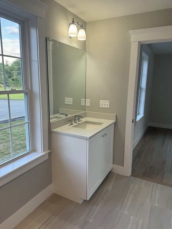 36 Meghan Circle Raynham, MA 02767 - Photo 30 of 37 a bathroom with a sink vanity and mirror