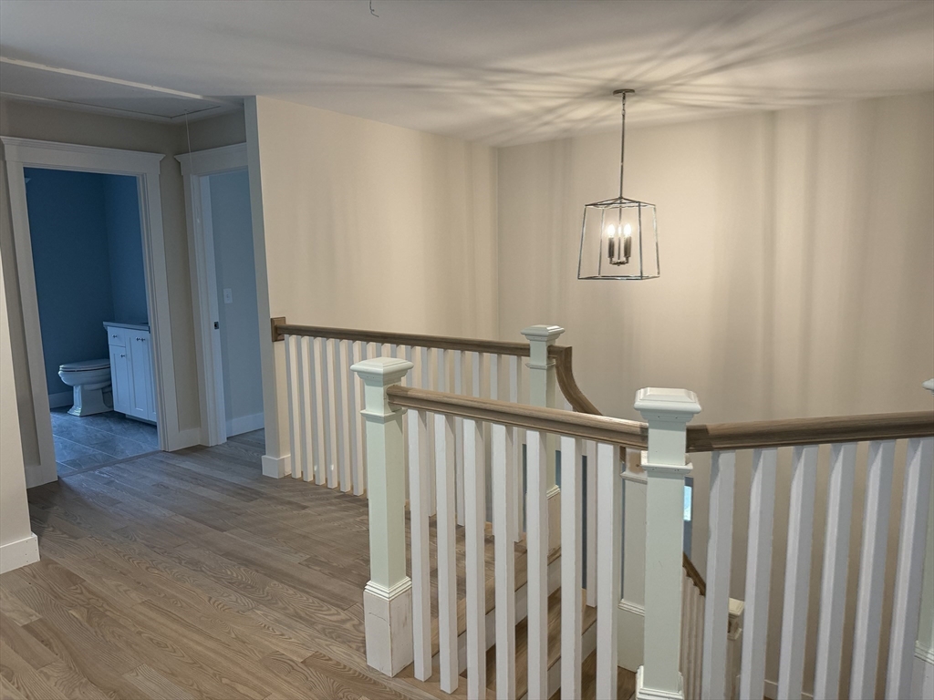 36 Meghan Circle Raynham, MA 02767 - Photo 32 of 37 a view of a hallway with wooden floor