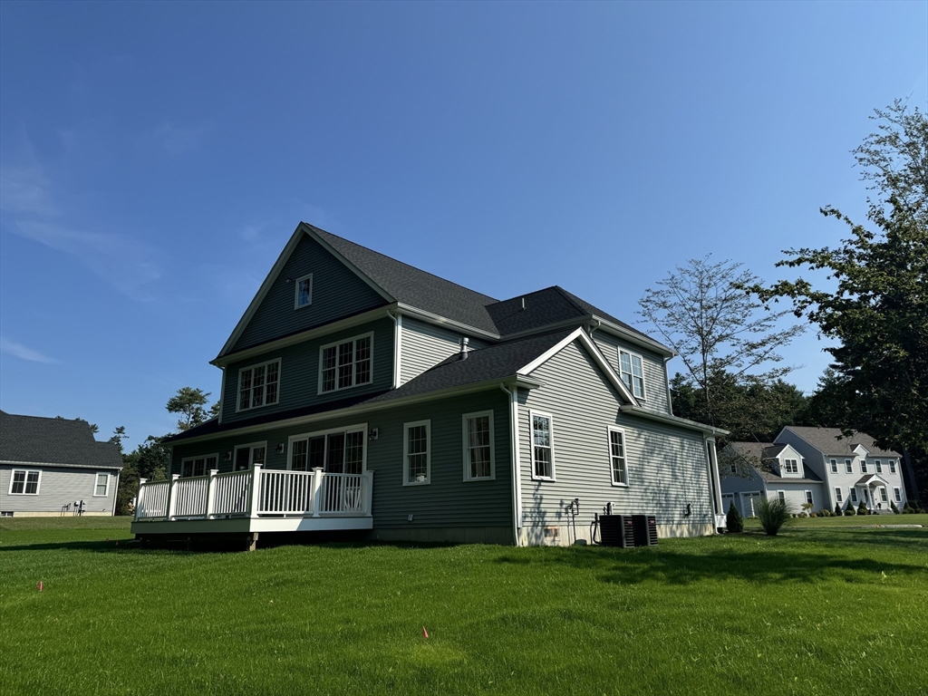 36 Meghan Circle Raynham, MA 02767 - Photo 36 of 37 a view of a house with a big yard and large trees