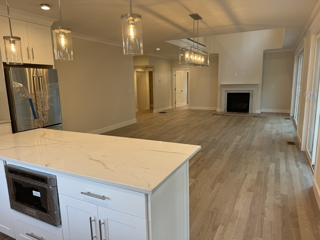 36 Meghan Circle Raynham, MA 02767 - Photo 8 of 37 a view of a kitchen with a sink and a refrigerator