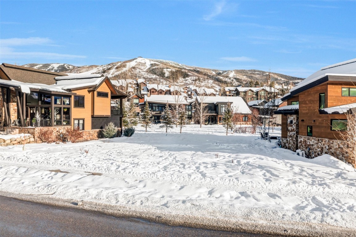 2648 Bronc Buster Loop Steamboat Springs, CO 80487 - Photo 2 of 11 a view of a building with a snow on the road