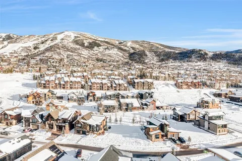 an aerial view of residential houses and city view