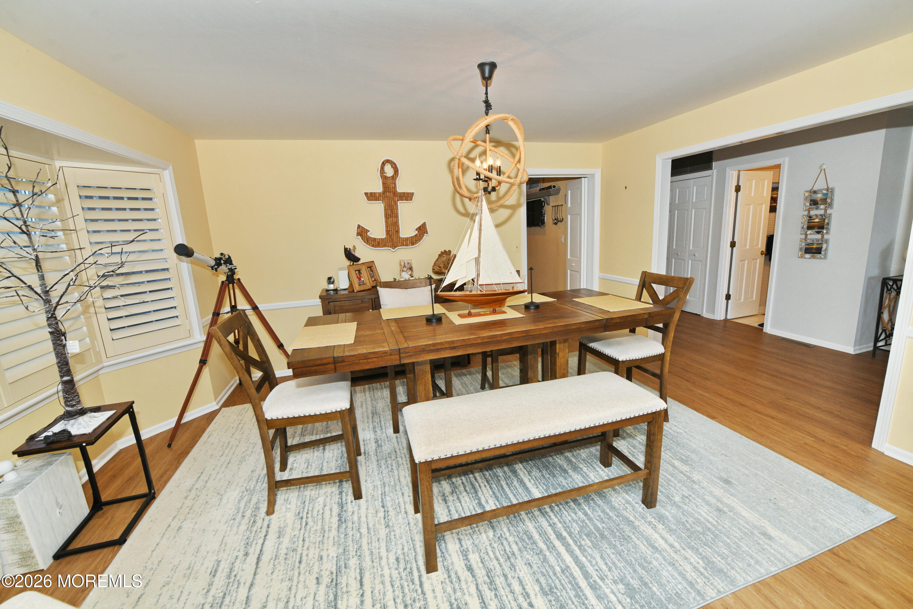 77 Bay Point Harbour Point Pleasant, NJ 08742 - Photo 12 of 39 a view of a dining room with furniture and wooden floor