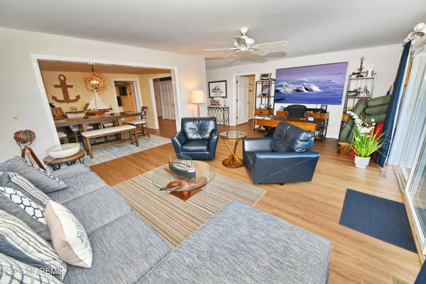 a living room with furniture fireplace and a flat screen tv
