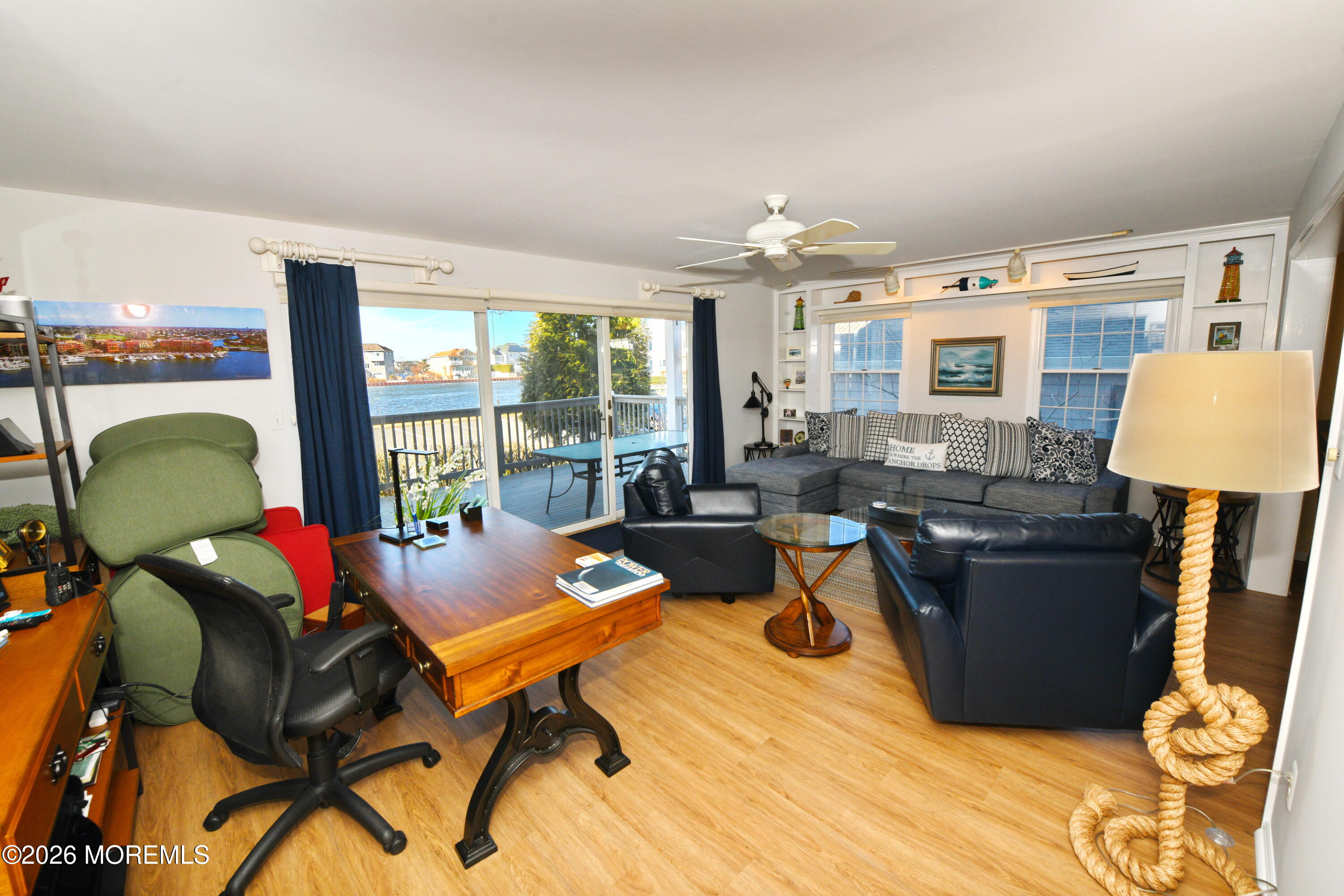 77 Bay Point Harbour Point Pleasant, NJ 08742 - Photo 16 of 39 a living room with furniture and a floor to ceiling window