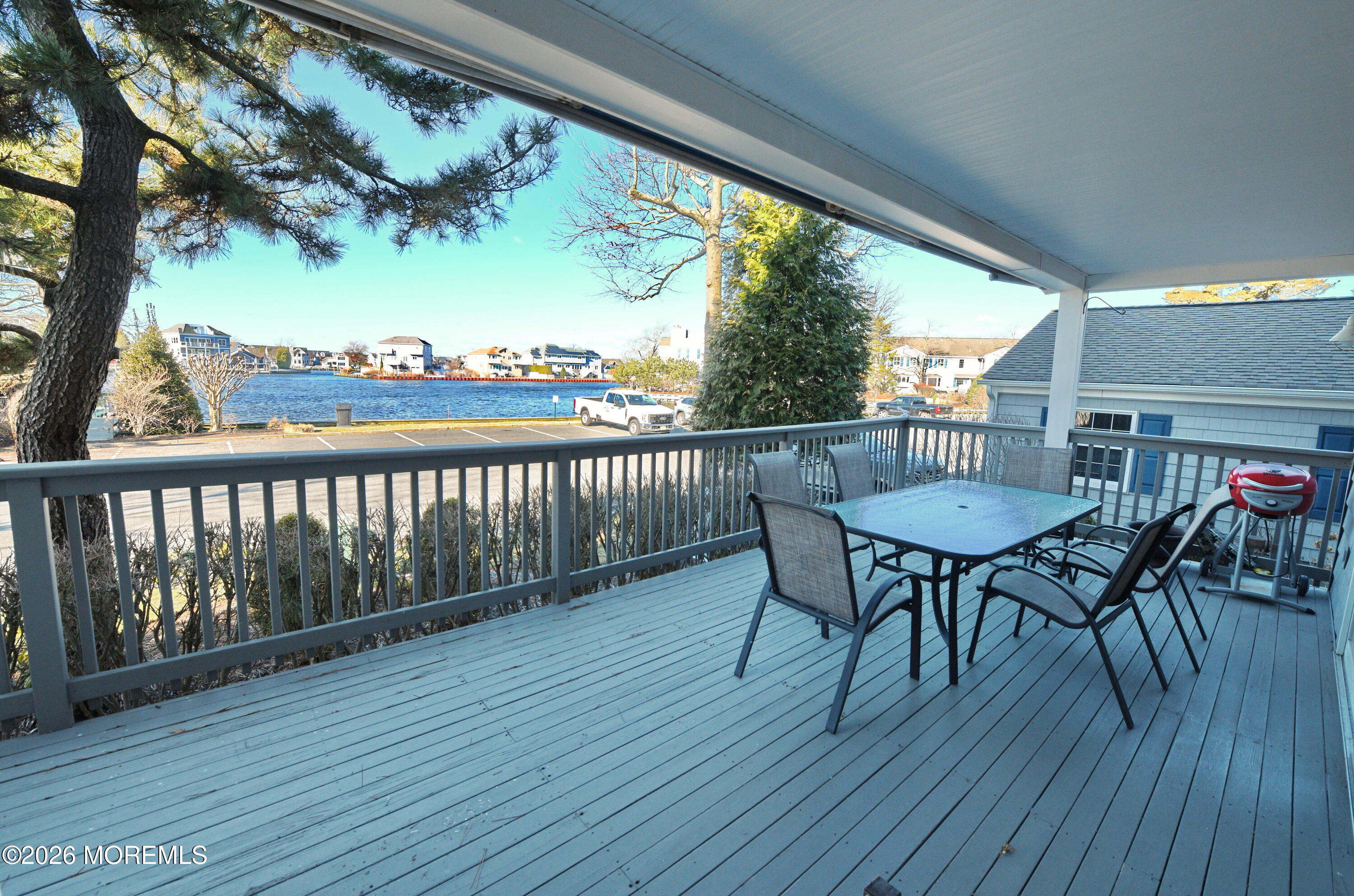 77 Bay Point Harbour Point Pleasant, NJ 08742 - Photo 25 of 39 a view of a chairs and table in patio with wooden floor