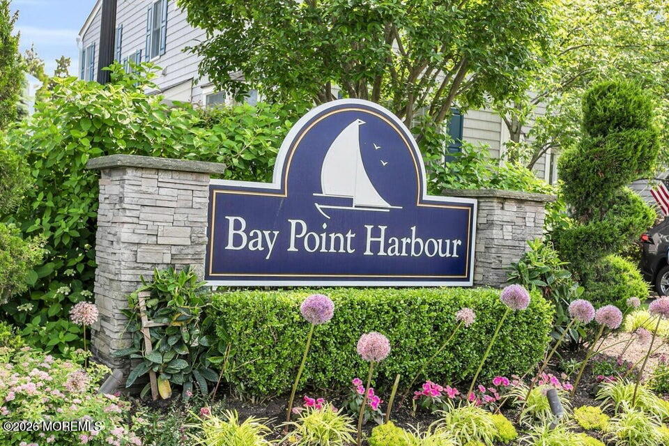 77 Bay Point Harbour Point Pleasant, NJ 08742 - Photo 34 of 39 a sign broad in front of flowers