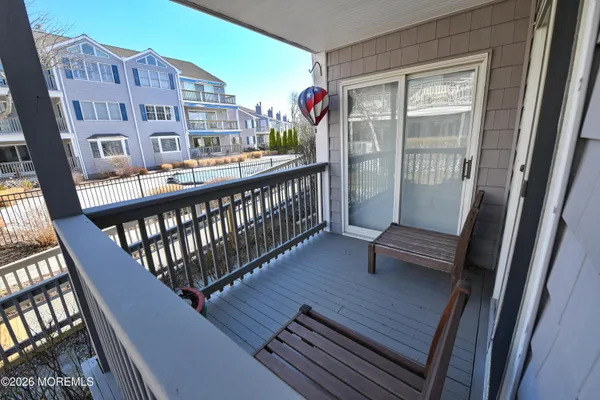 a balcony with outdoor seating