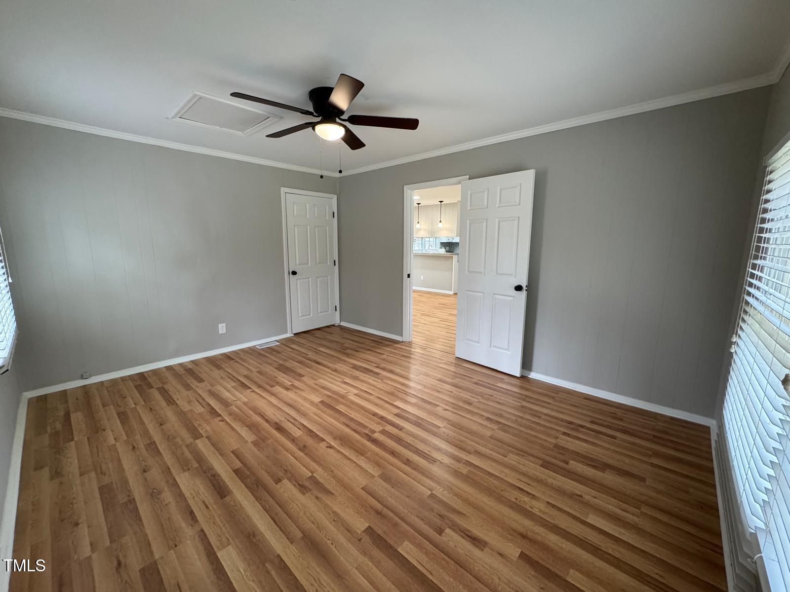 2616 Firelight Road Raleigh, NC 27610 - Photo 29 of 36 a view of empty room with wooden floor and fan