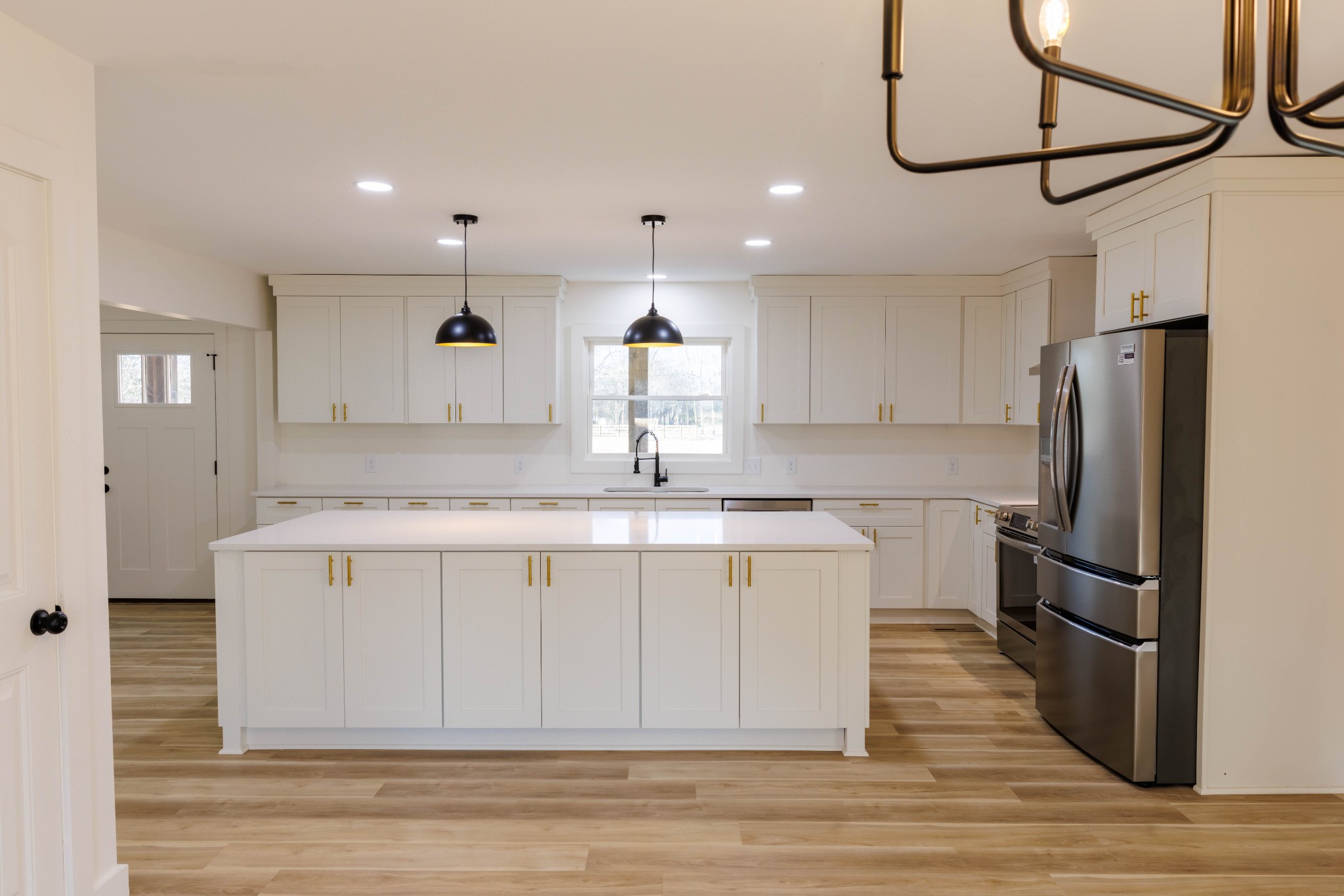 2239 Hunter Bills Road Lewisburg, TN 37091 - Photo 14 of 53 a kitchen with a refrigerator a sink and cabinets