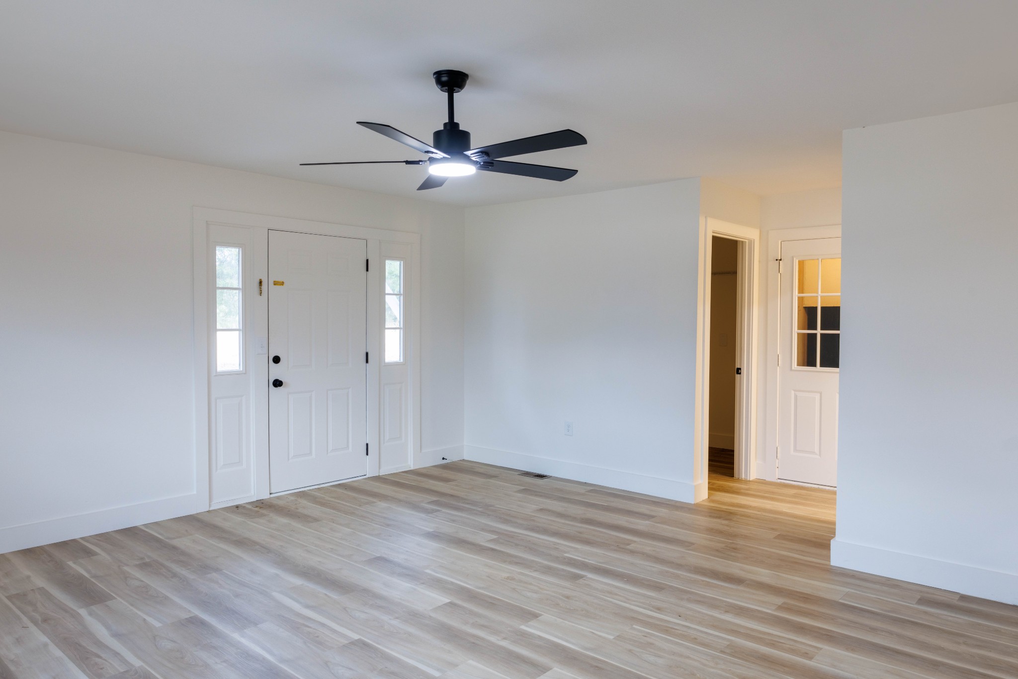2239 Hunter Bills Road Lewisburg, TN 37091 - Photo 20 of 53 a view of empty room with wooden floor and ceiling fan
