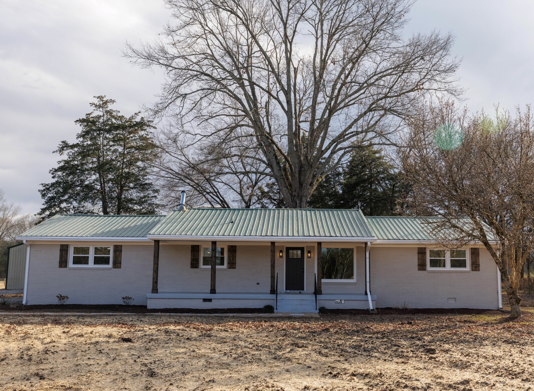 2239 Hunter Bills Road Lewisburg, TN 37091 - Photo 2 of 53 a front view of a house with a garden