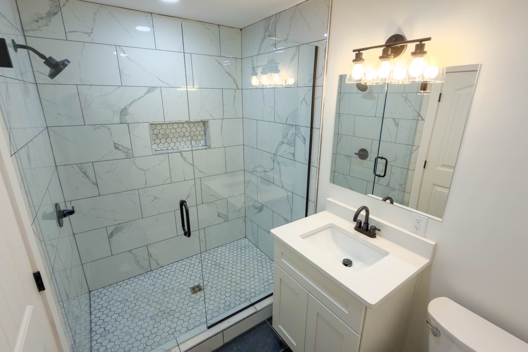 2239 Hunter Bills Road Lewisburg, TN 37091 - Photo 24 of 53 a bathroom with a sink a toilet and shower