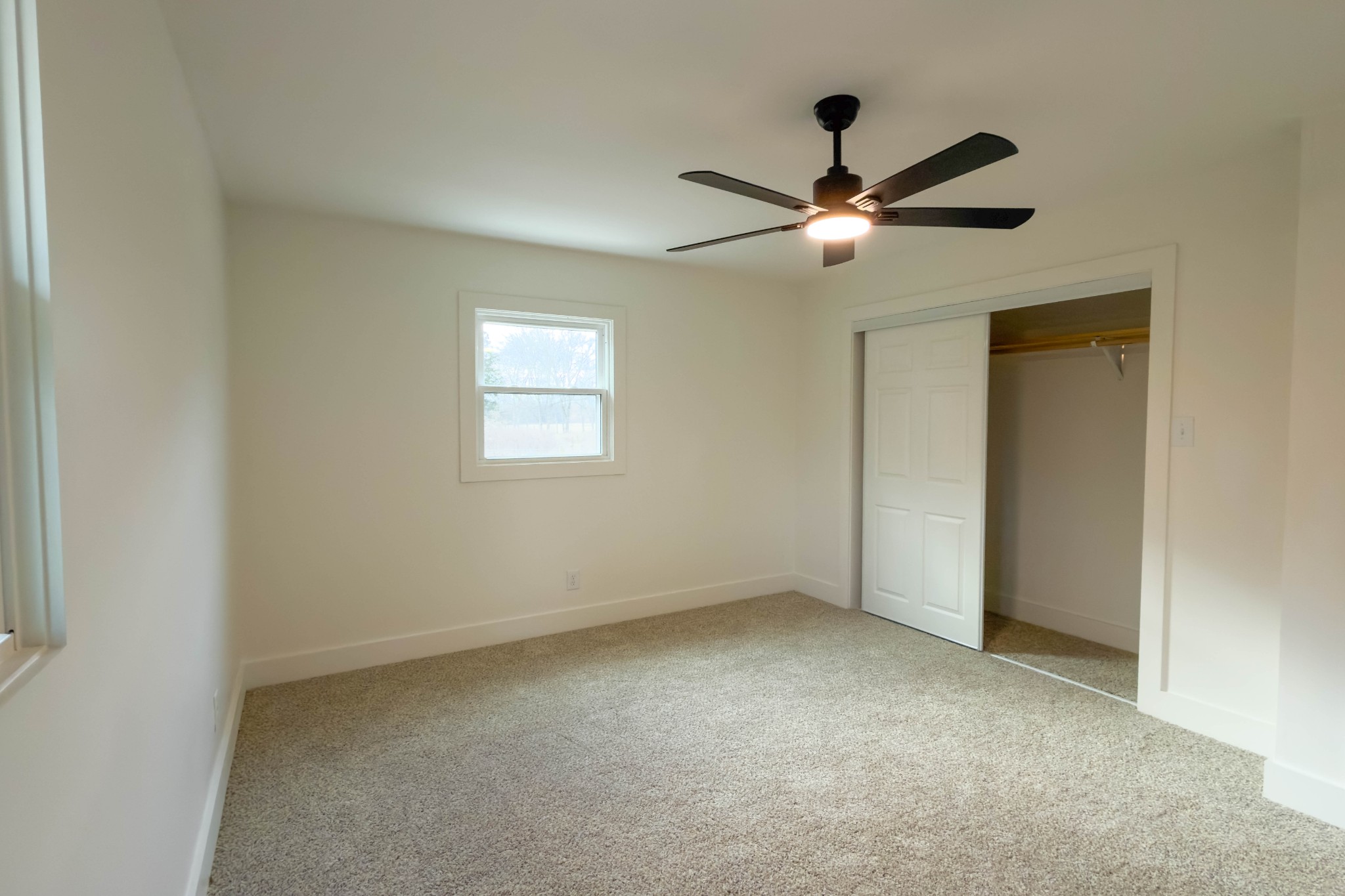 2239 Hunter Bills Road Lewisburg, TN 37091 - Photo 29 of 53 a view of an empty room with a ceiling fan