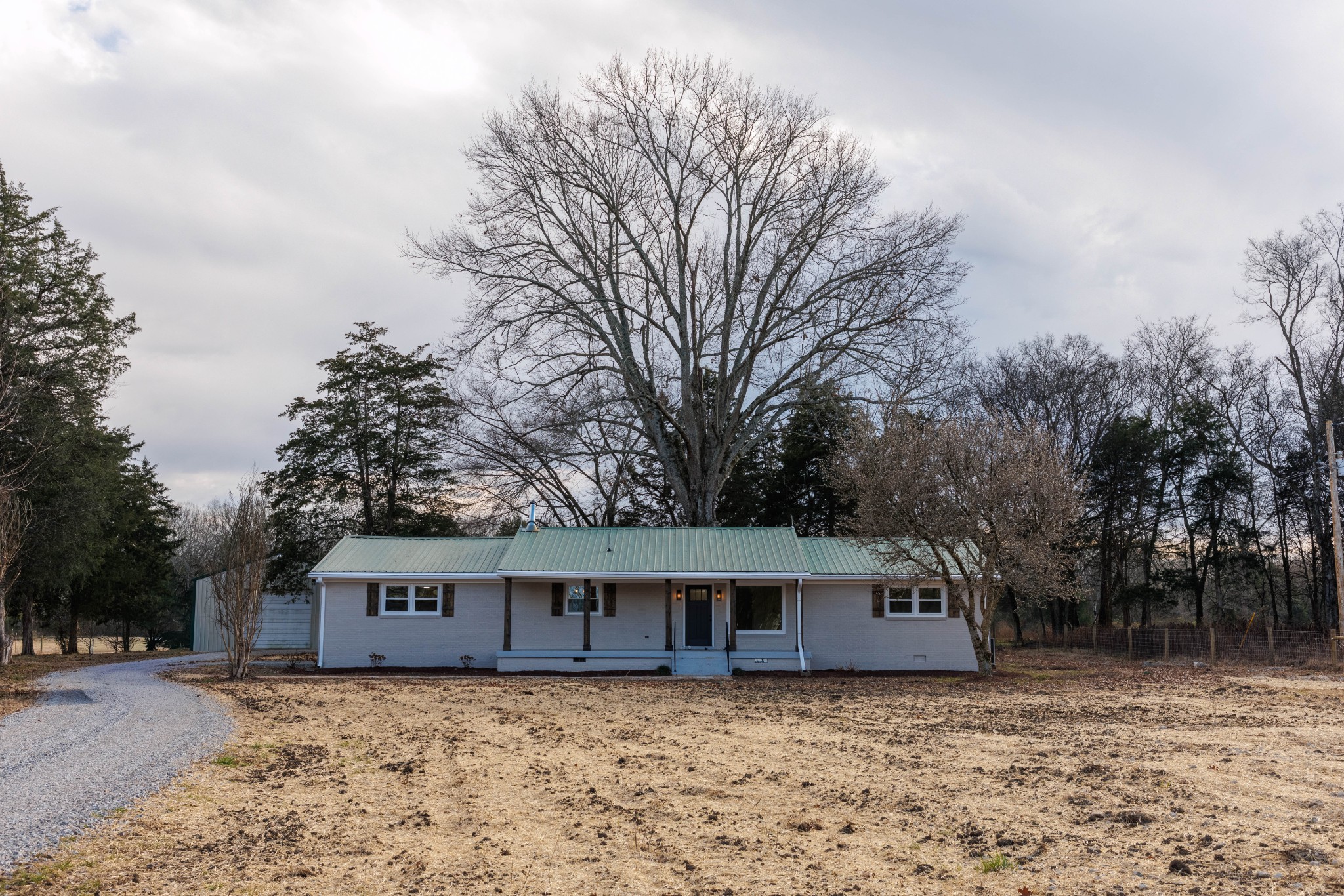 2239 Hunter Bills Road Lewisburg, TN 37091 - Photo 7 of 53 a house that has a tree in front of it
