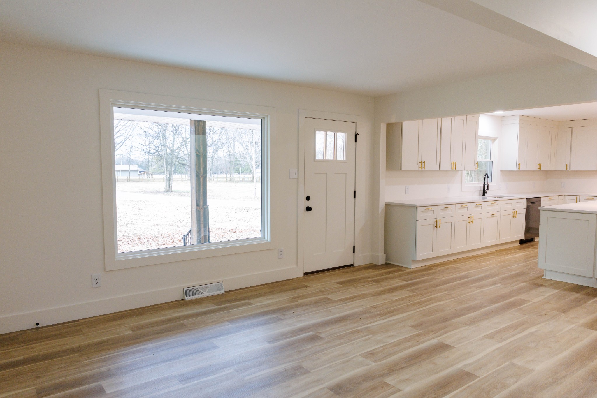 2239 Hunter Bills Road Lewisburg, TN 37091 - Photo 10 of 53 a view of a kitchen with wooden floor and windows