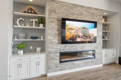 a kitchen with stainless steel appliances kitchen island granite countertop a sink and a refrigerator