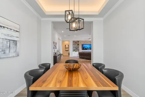 a large kitchen with kitchen island a large window a sink and appliances