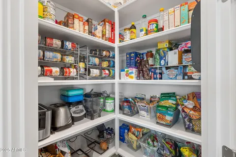 a bathroom with a double vanity sink and mirror