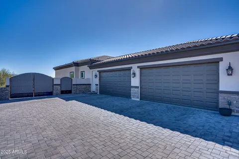 a view of a livingroom with wooden floor and a potted plant