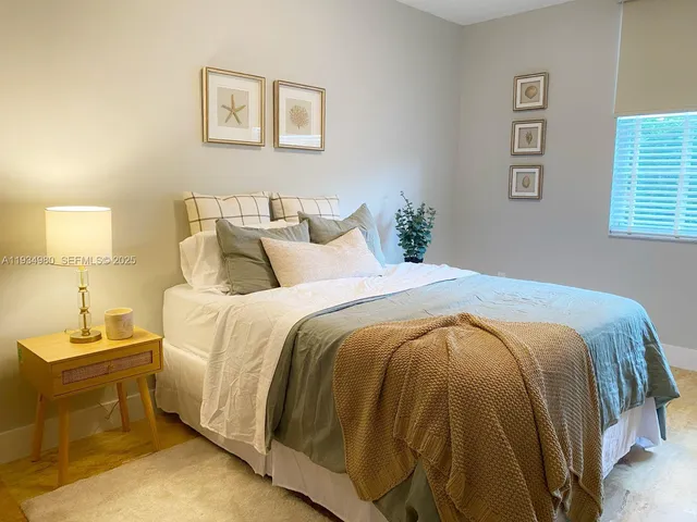 a bed room with a bed and a night stand