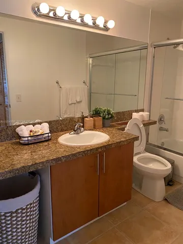 a view of multiple houses with a yard