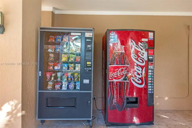 a view of a patio with a table chairs and a backyard