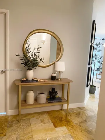 a view of entryway with livingroom