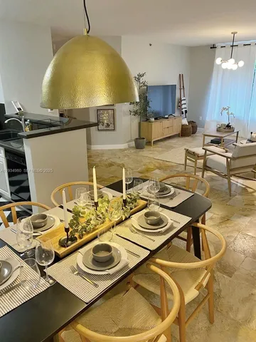 a kitchen with a table and chairs in it