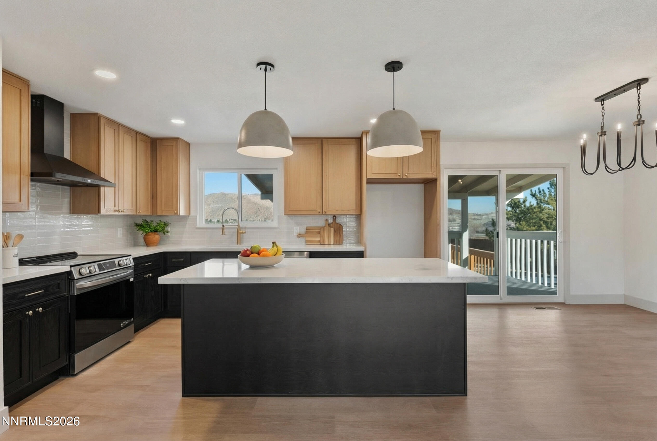 8 Zane Grey Lane Reno, NV 89523 - Photo 18 of 43 a kitchen with stainless steel appliances granite countertop a sink a stove and a wooden floors