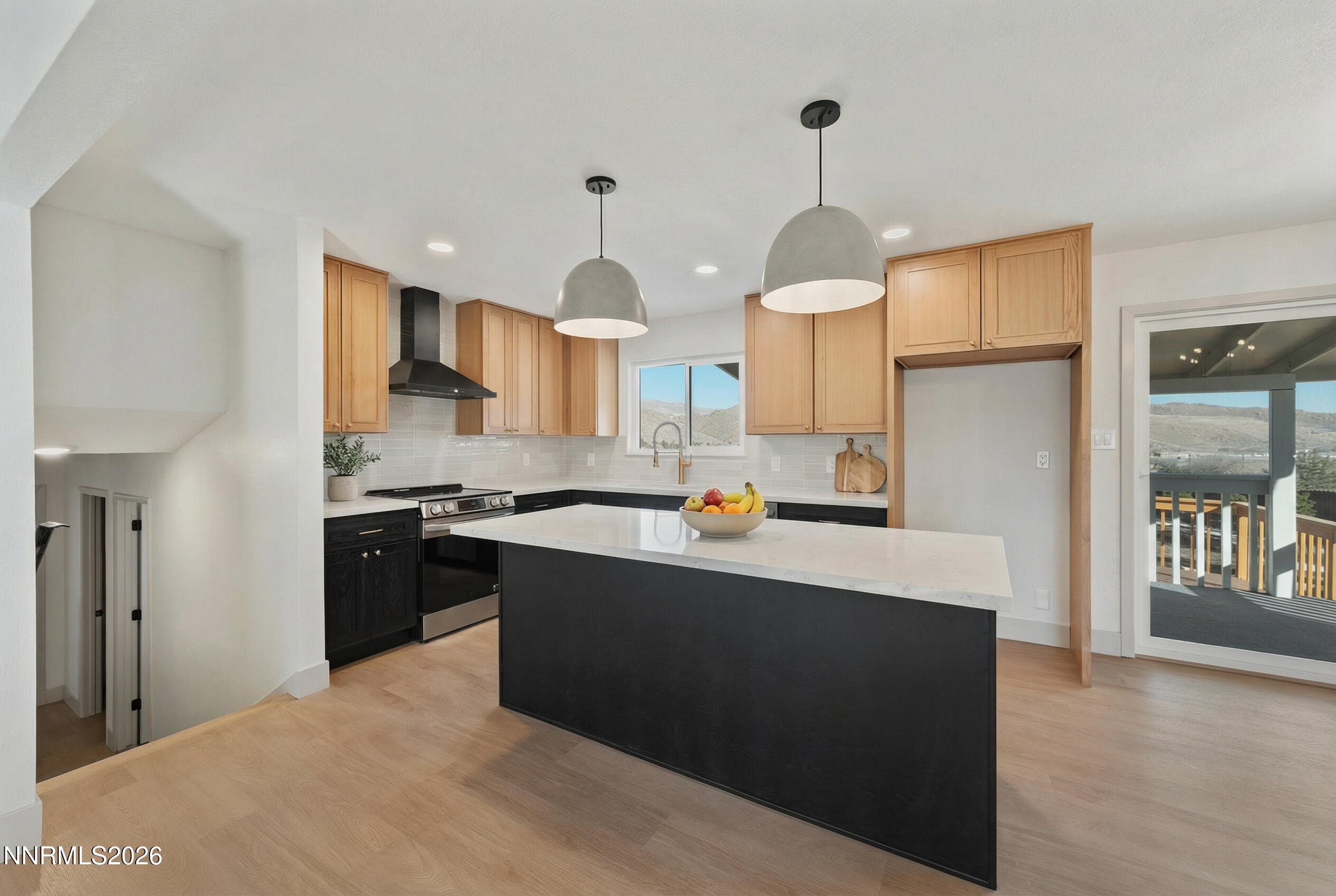 8 Zane Grey Lane Reno, NV 89523 - Photo 20 of 43 a kitchen with stainless steel appliances granite countertop a refrigerator a sink dishwasher a stove and white cabinets next to a window