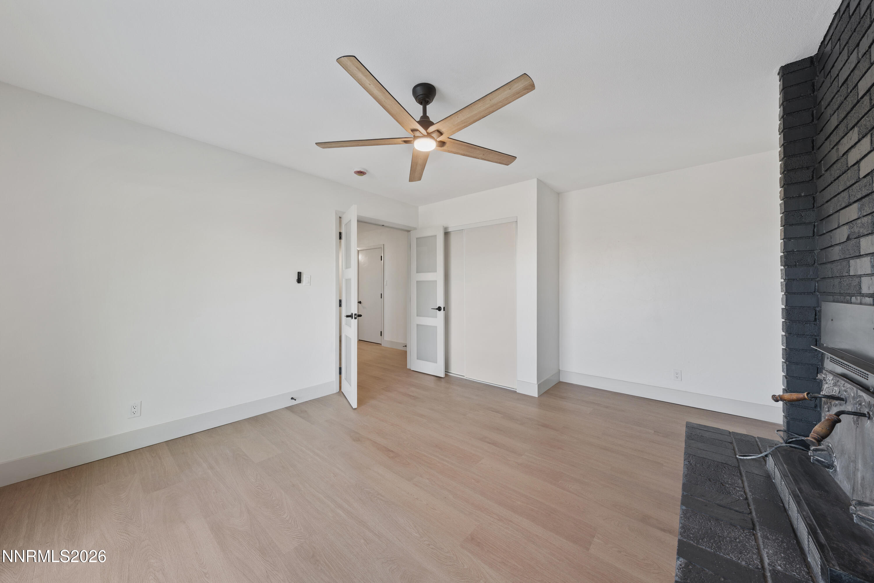 8 Zane Grey Lane Reno, NV 89523 - Photo 23 of 43 an empty room with closet and a ceiling fan