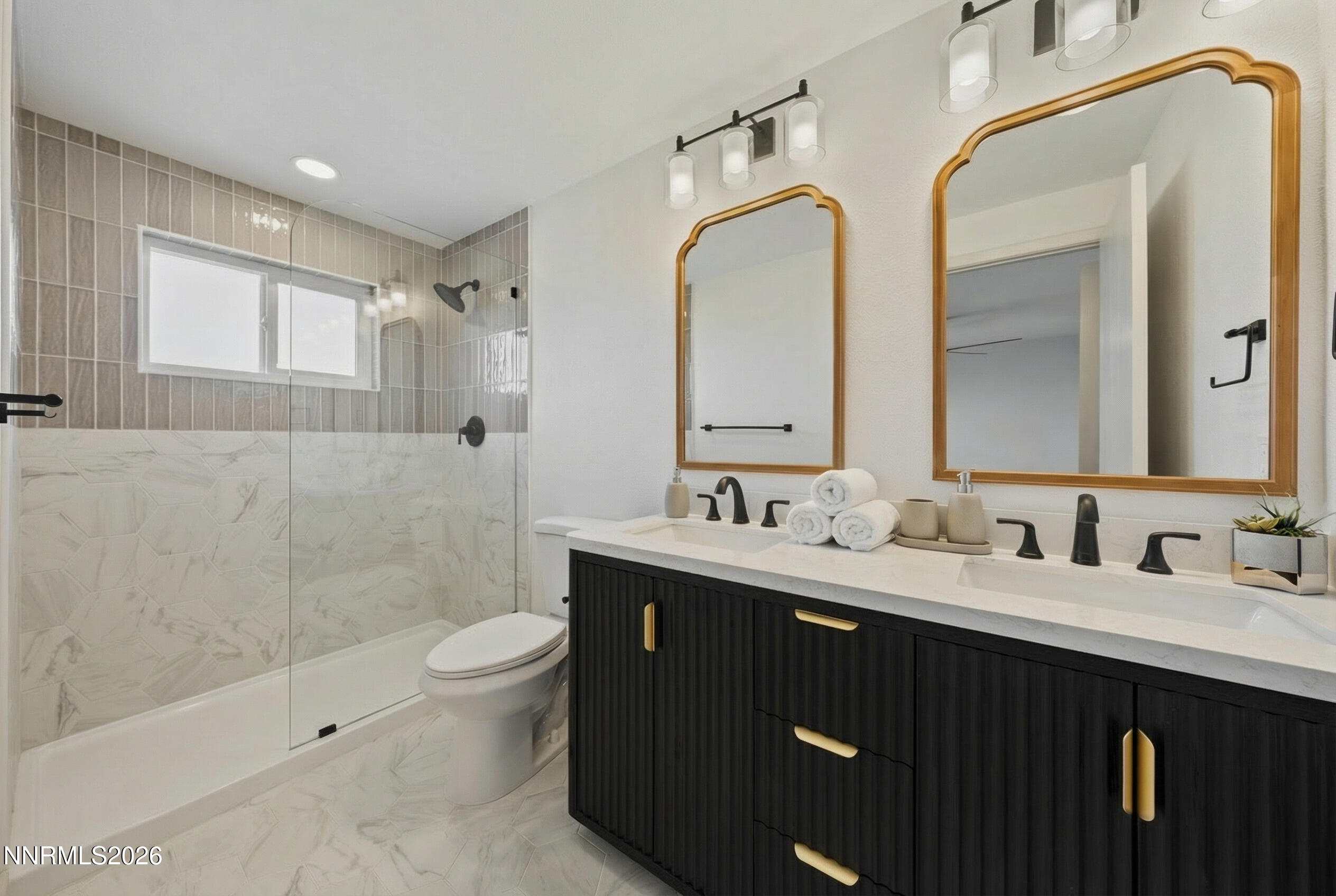 8 Zane Grey Lane Reno, NV 89523 - Photo 30 of 43 a bathroom with a double vanity sink toilet and a mirror