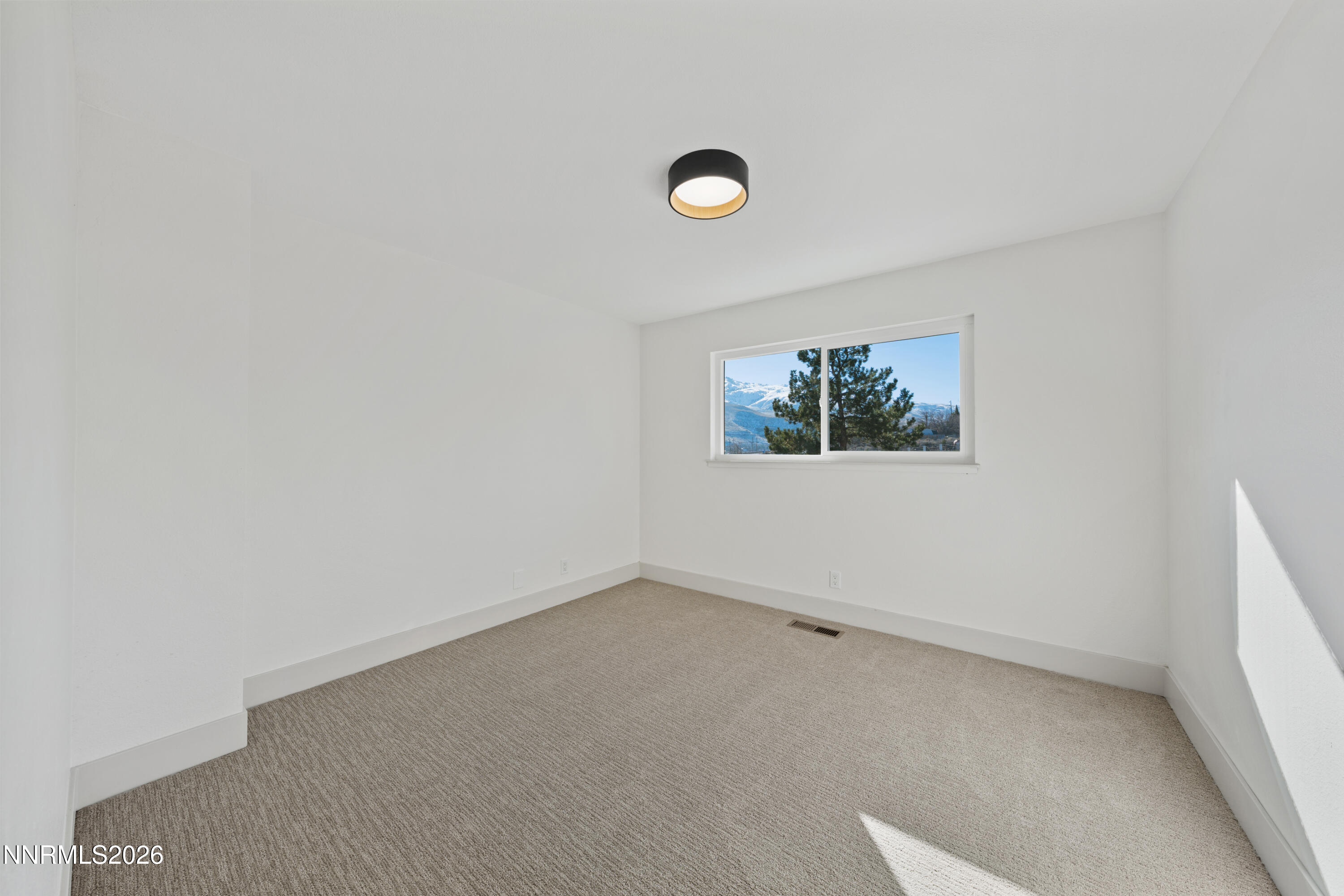 8 Zane Grey Lane Reno, NV 89523 - Photo 32 of 43 an empty room with a window